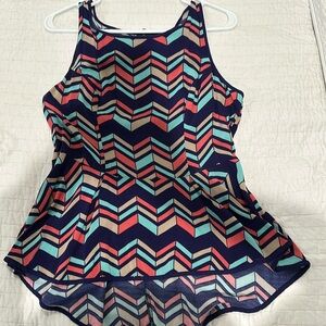 Beautiful colorful blouse with zipper down back.  Peplum style shirt.